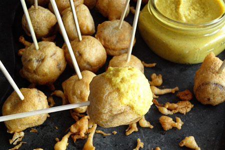 Beer-Battered Brat Lolipops with Spicy Kraut Mustard (via patiodaddiobbq.com)